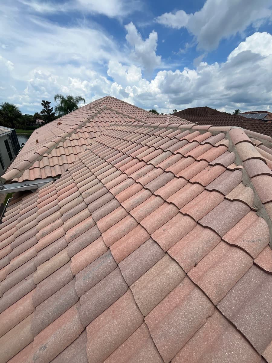 Ridge of a Southwest Florida tile roof with no ridge vents or off-ridge vents installed anywhere along it